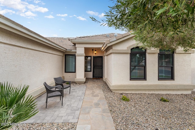 property entrance with a patio area