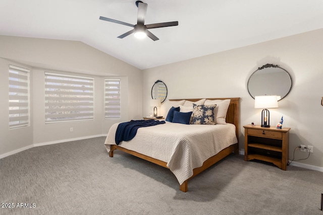 bedroom with ceiling fan, vaulted ceiling, and carpet flooring