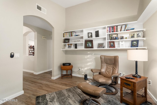 sitting room with hardwood / wood-style floors