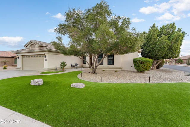 obstructed view of property featuring a garage and a front lawn