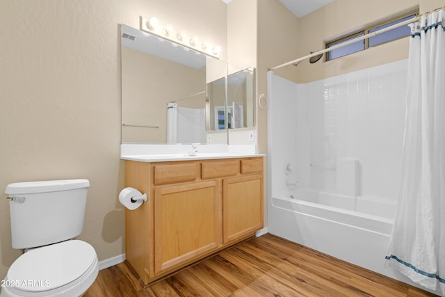 full bathroom featuring toilet, vanity, wood finished floors, and shower / tub combo with curtain