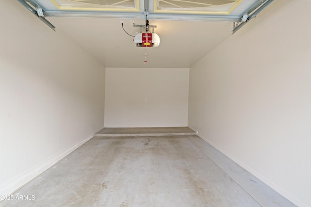 garage featuring baseboards and a garage door opener