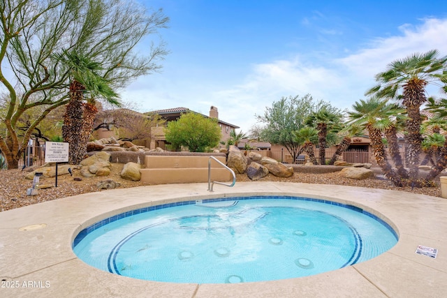 view of pool with fence