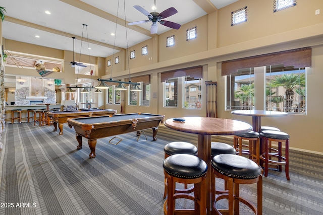 playroom with carpet, recessed lighting, pool table, a towering ceiling, and a ceiling fan