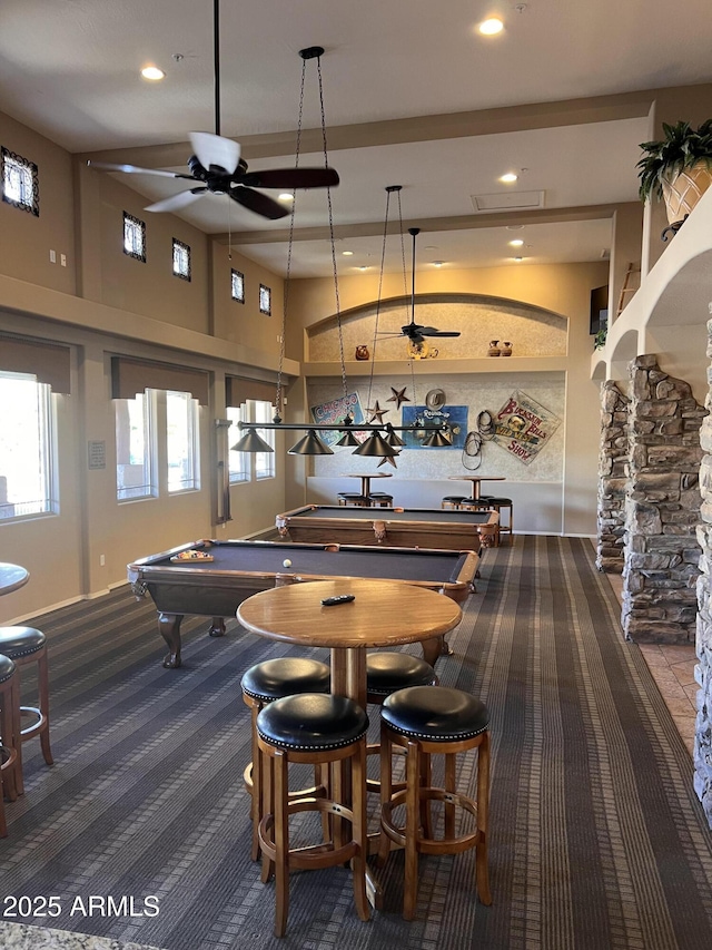 playroom with ceiling fan, a high ceiling, carpet, and recessed lighting