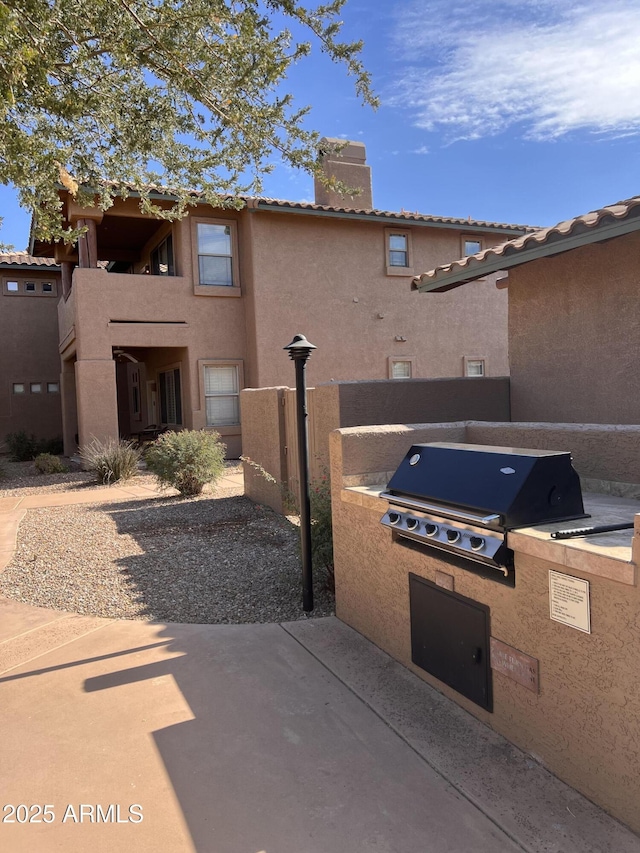 view of patio / terrace with exterior kitchen and area for grilling