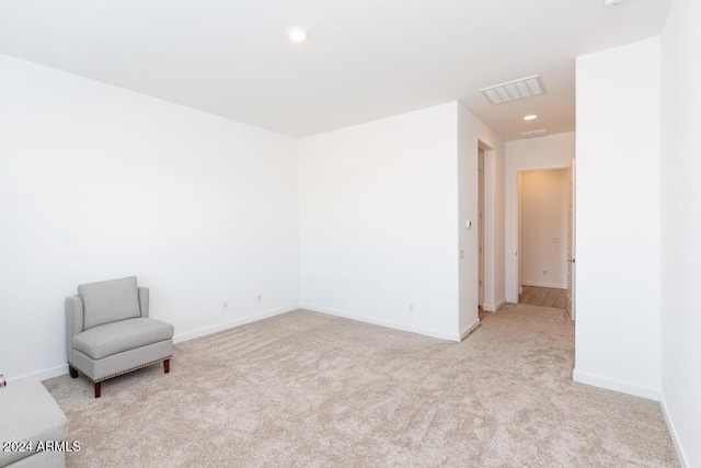 interior space featuring light colored carpet