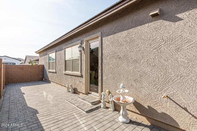 wooden terrace with a patio