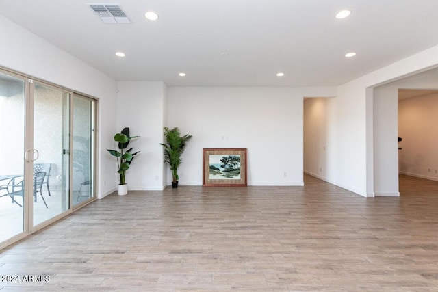 unfurnished living room with light hardwood / wood-style flooring