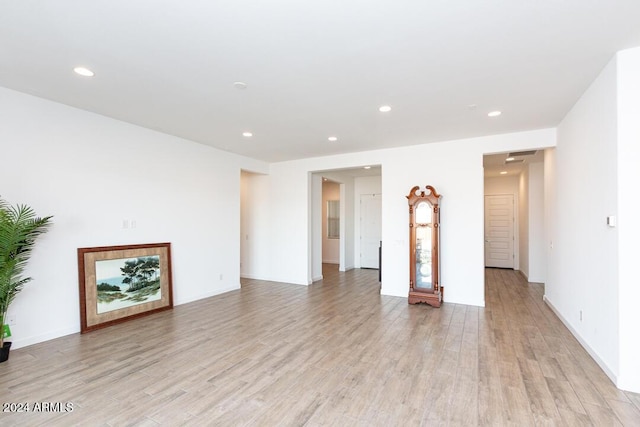 unfurnished living room featuring light hardwood / wood-style floors