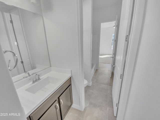 full bathroom with tile patterned floors, toilet, and vanity