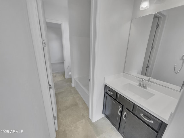 full bathroom with toilet and vanity