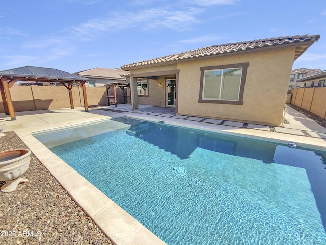 view of swimming pool featuring a gazebo, a patio area, and a fenced backyard