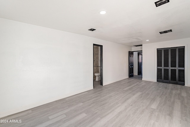 unfurnished room featuring light wood-type flooring