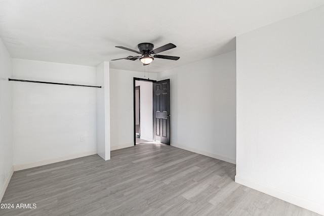 unfurnished room featuring ceiling fan and light hardwood / wood-style floors