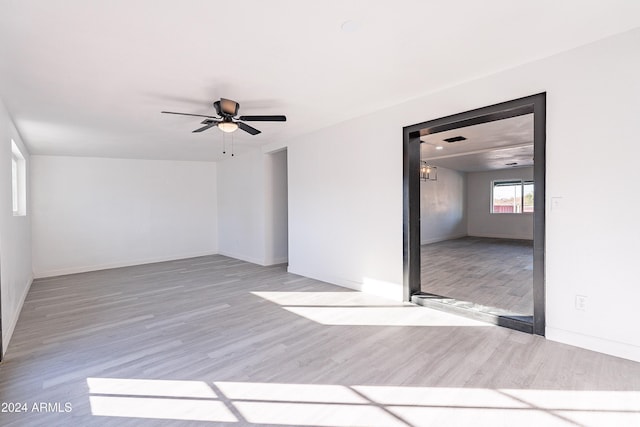 spare room featuring hardwood / wood-style floors and ceiling fan