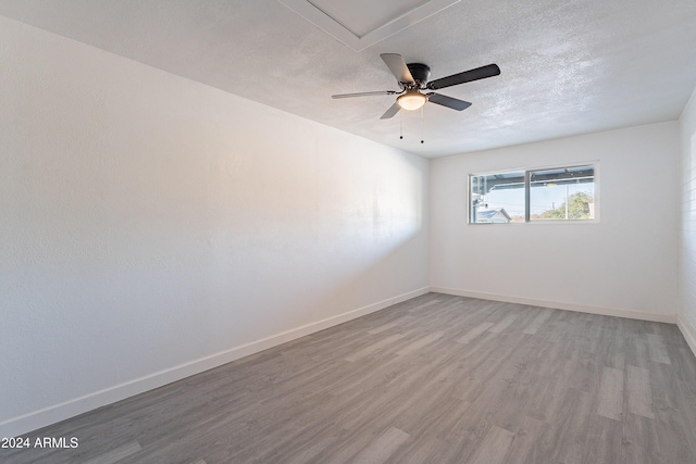 spare room featuring ceiling fan and wood-type flooring