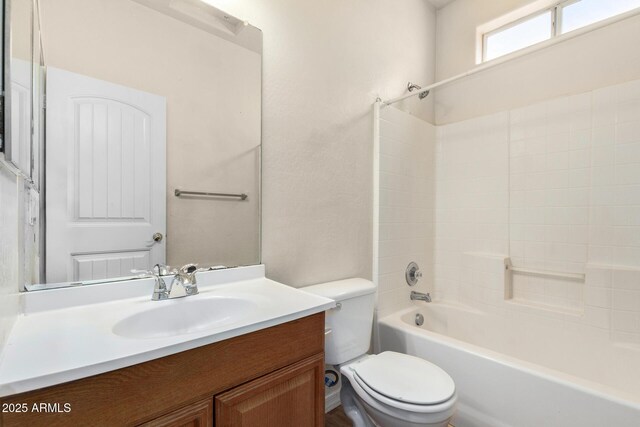 full bath with toilet, shower / washtub combination, and vanity