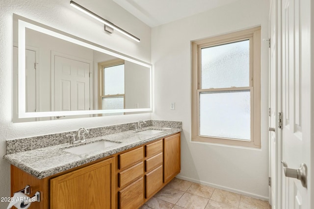 bathroom with vanity and tile patterned floors