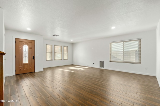 entryway with a healthy amount of sunlight and a textured ceiling