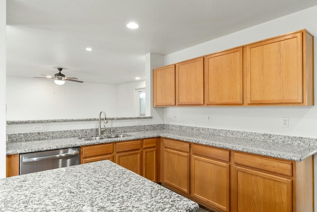 kitchen featuring ceiling fan, sink, stainless steel dishwasher, and light stone counters