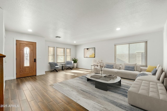 living room with a textured ceiling