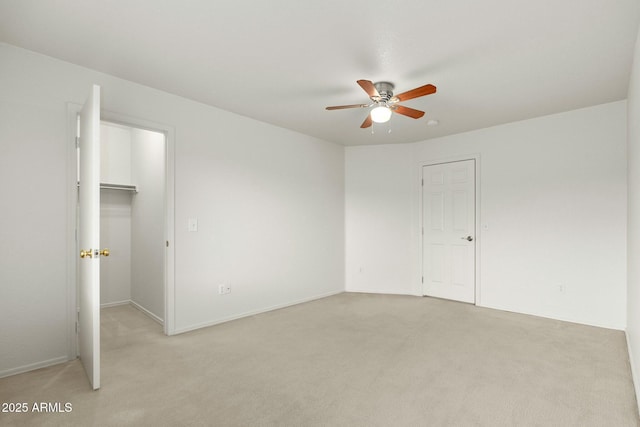 unfurnished bedroom with ceiling fan and light colored carpet