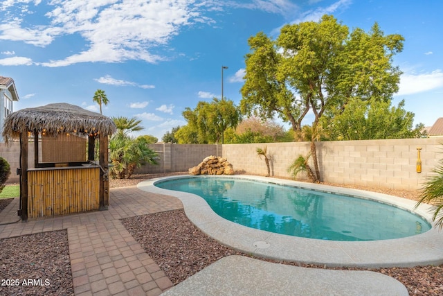 view of swimming pool featuring a gazebo and a patio area