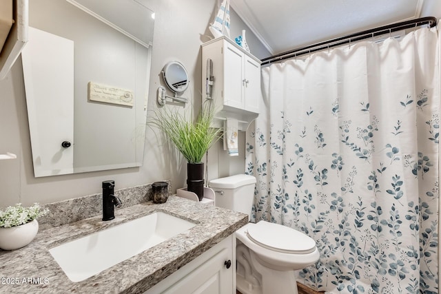 full bathroom with ornamental molding, curtained shower, vanity, and toilet