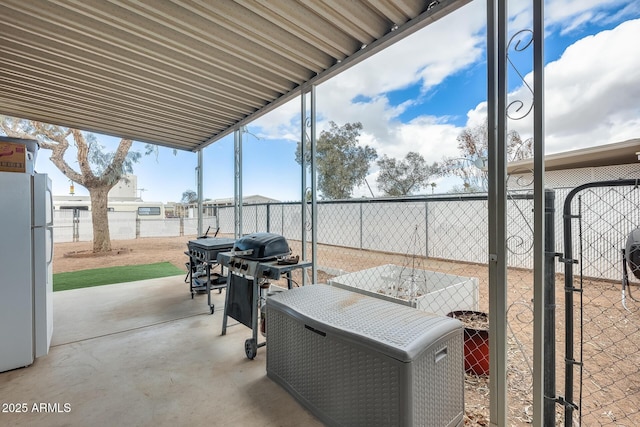 view of patio / terrace with area for grilling and a fenced backyard