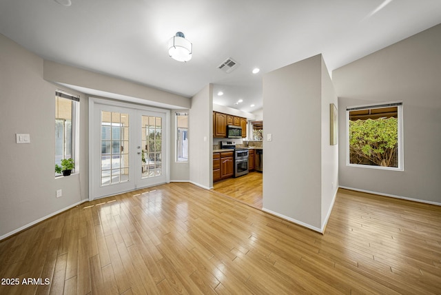 unfurnished living room with light hardwood / wood-style floors