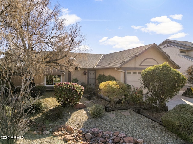 ranch-style house featuring a garage