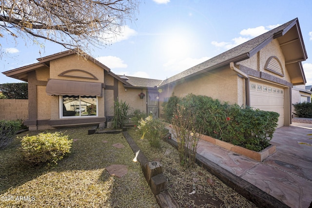 single story home with a garage