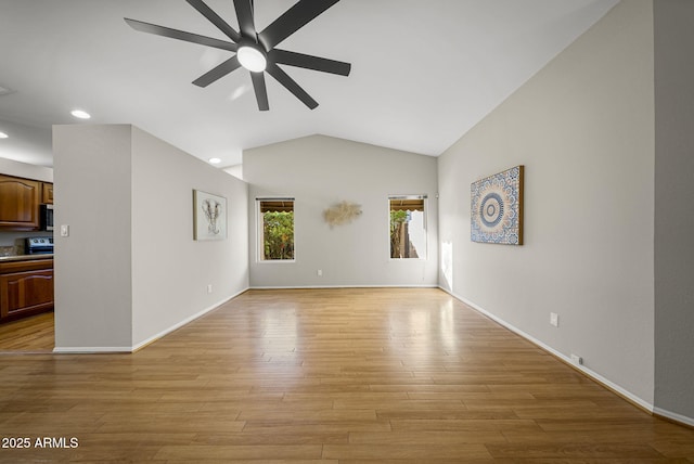 unfurnished living room featuring ceiling fan, light hardwood / wood-style floors, and lofted ceiling