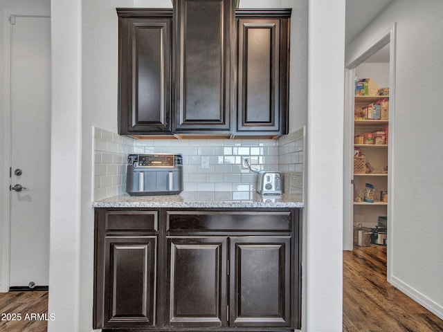 4132 W Tunnel Mine Rd, New River, AZ 85087 - bar area with dark wood-type flooring and decorative backsplash