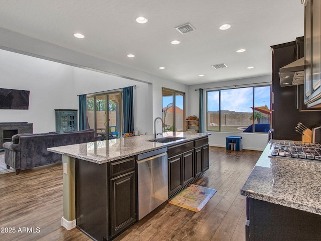 4132 W Tunnel Mine Rd, New River, AZ 85087 - kitchen with appliances with stainless steel finishes, a sink, dark wood finished floors, an island with sink, and recessed lighting