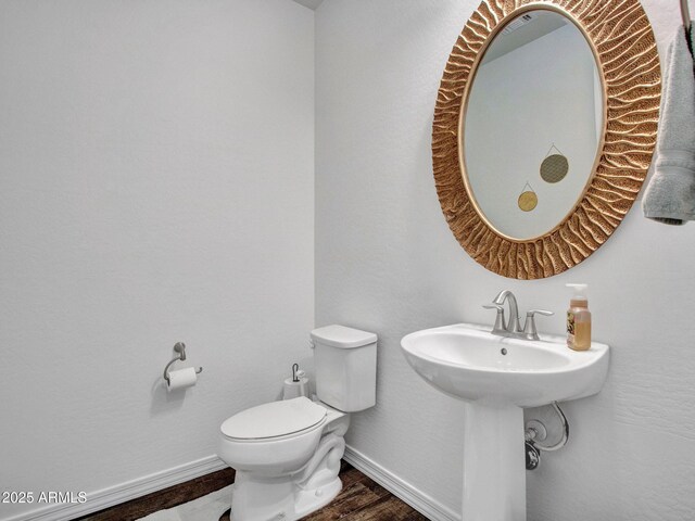 4132 W Tunnel Mine Rd, New River, AZ 85087 - bathroom with toilet, wood finished floors, and baseboards