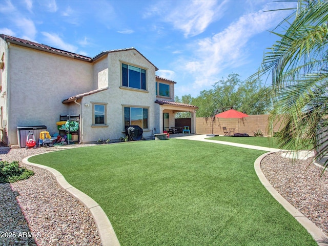4132 W Tunnel Mine Rd, New River, AZ 85087 - back of property with stucco siding, a patio area, and a tiled roof