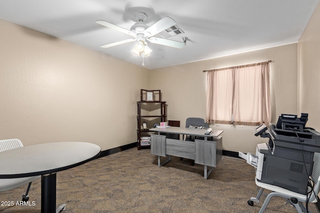 office area featuring dark carpet, ceiling fan, and baseboards