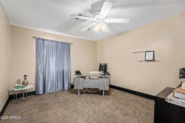 office area featuring carpet floors, a ceiling fan, and baseboards