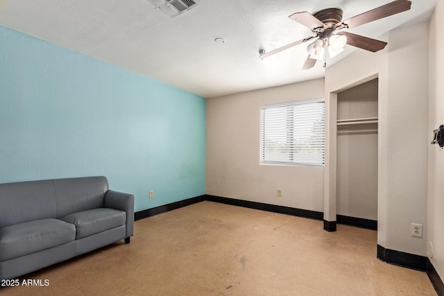 unfurnished bedroom with baseboards, a closet, a ceiling fan, and concrete flooring