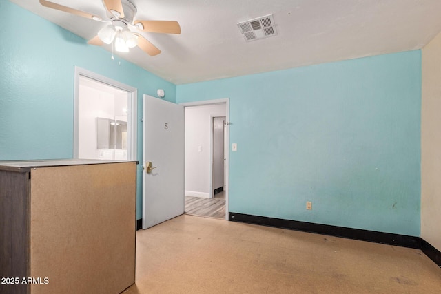 unfurnished room featuring a ceiling fan