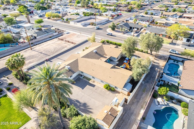 aerial view of residential area with a pool