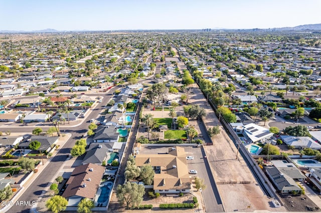 aerial overview of property's location with nearby suburban area and mountains
