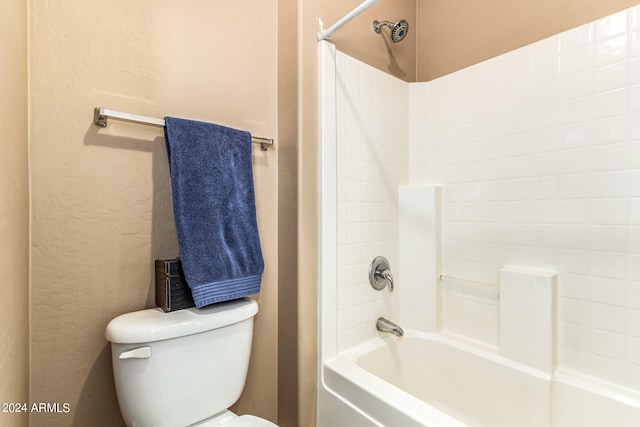 bathroom with toilet and shower / tub combination