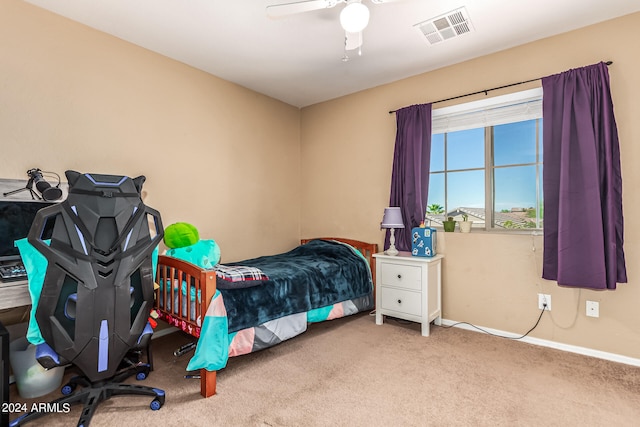 bedroom with ceiling fan and light colored carpet