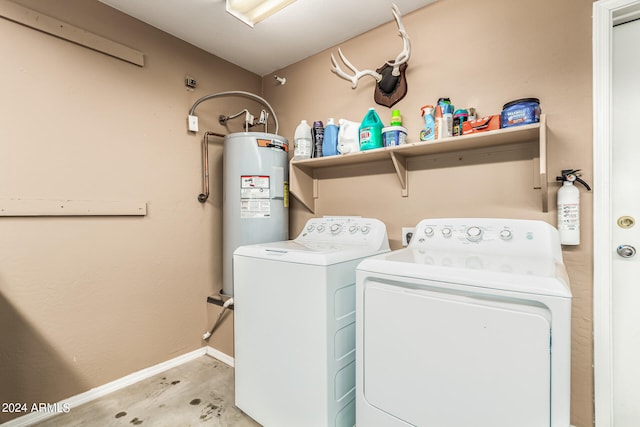 washroom with water heater and washing machine and clothes dryer