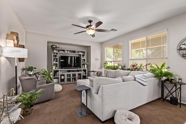 7031 W Lone Tree Trl, Peoria, AZ 85383 - living area with ceiling fan and carpet flooring