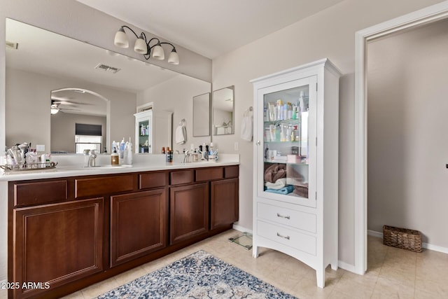 7031 W Lone Tree Trl, Peoria, AZ 85383 - bathroom featuring double vanity, ceiling fan, and tile patterned floors