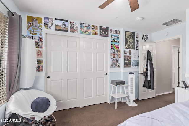7031 W Lone Tree Trl, Peoria, AZ 85383 - bedroom featuring dark colored carpet, a closet, and ceiling fan